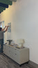 Man installing an Acadia National Park mural in a commercial office space.