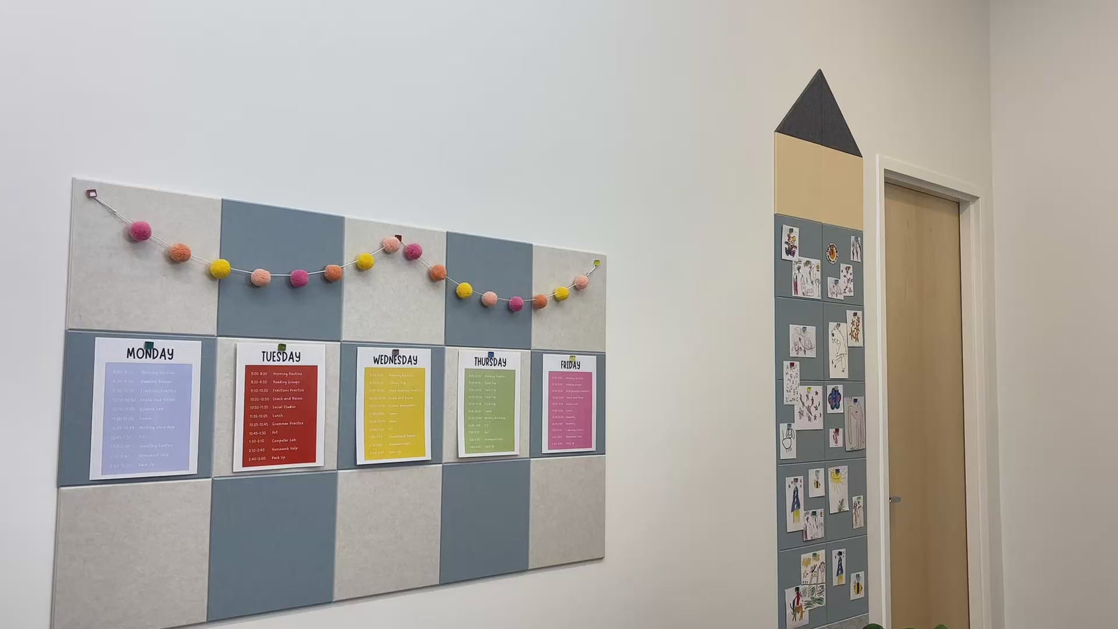 Classroom with multiple colors of checkerboard and pencil bulletin boards with papers pinned to them