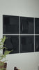 Women Installing black dimensional wall panels in her kitchen.