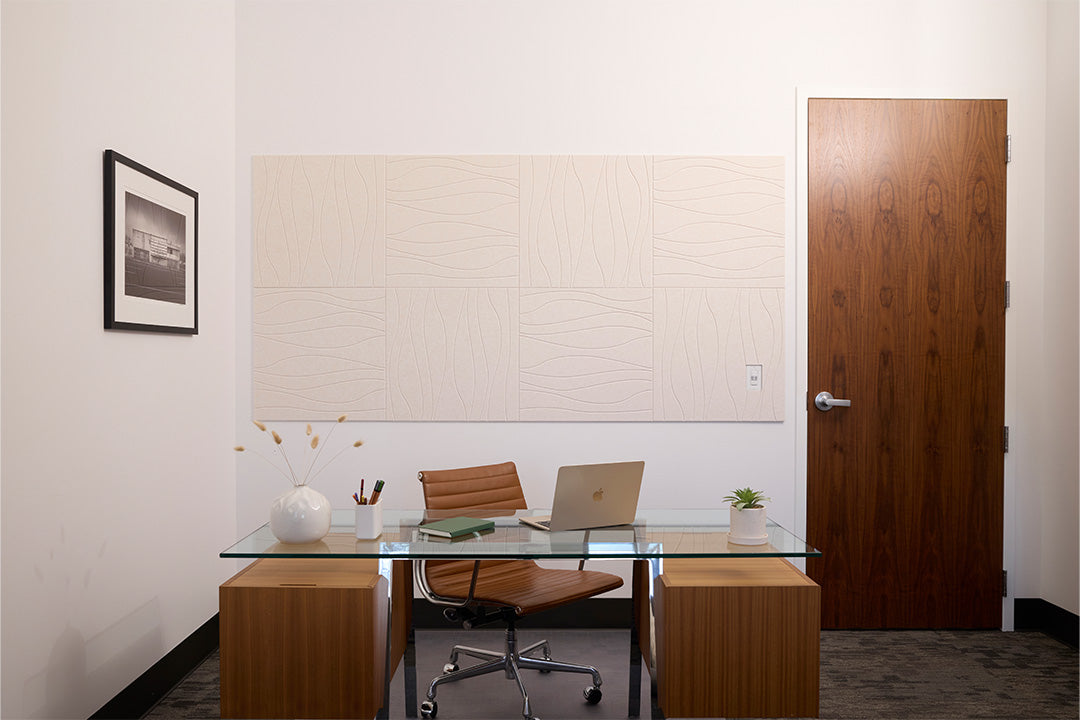 A Felt Right wall design in a cream shade with a river like pattern in an office behind a desk next to a door