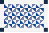 Repeating geometric pinwheel pattern in navy, gray, and white triangles on grid background.