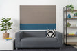A Felt Right wall design in stacked shiplap  felt tiles in ash grey-brown and slate blue applied on a wall, with a modern sofa and pillows in the foreground.