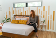 Felt Right Bamboo design in shades of orange lining a wall in a bedroom or entry way