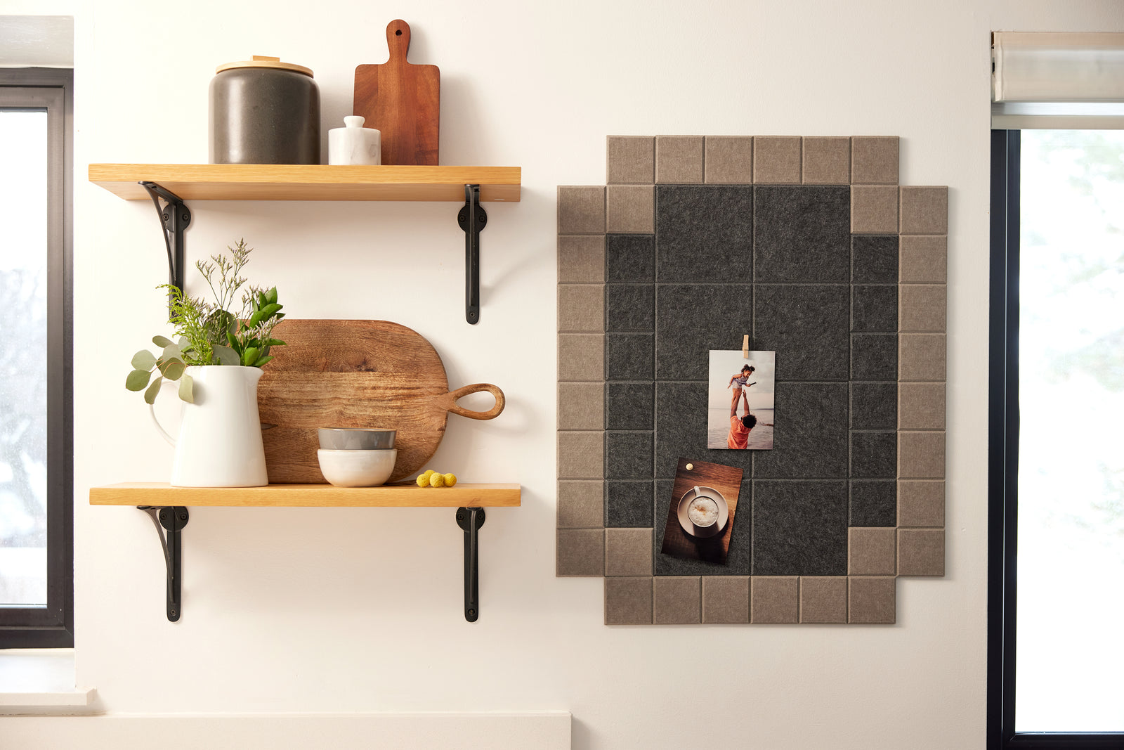 A Felt Right wall art design in shades of brown that is pinnable next to two shelves.