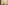 Felt Right wall art design using yellow and cream felt tiles in a shiplap look on a wall in a kitchen with a woman sitting at the kitchen table